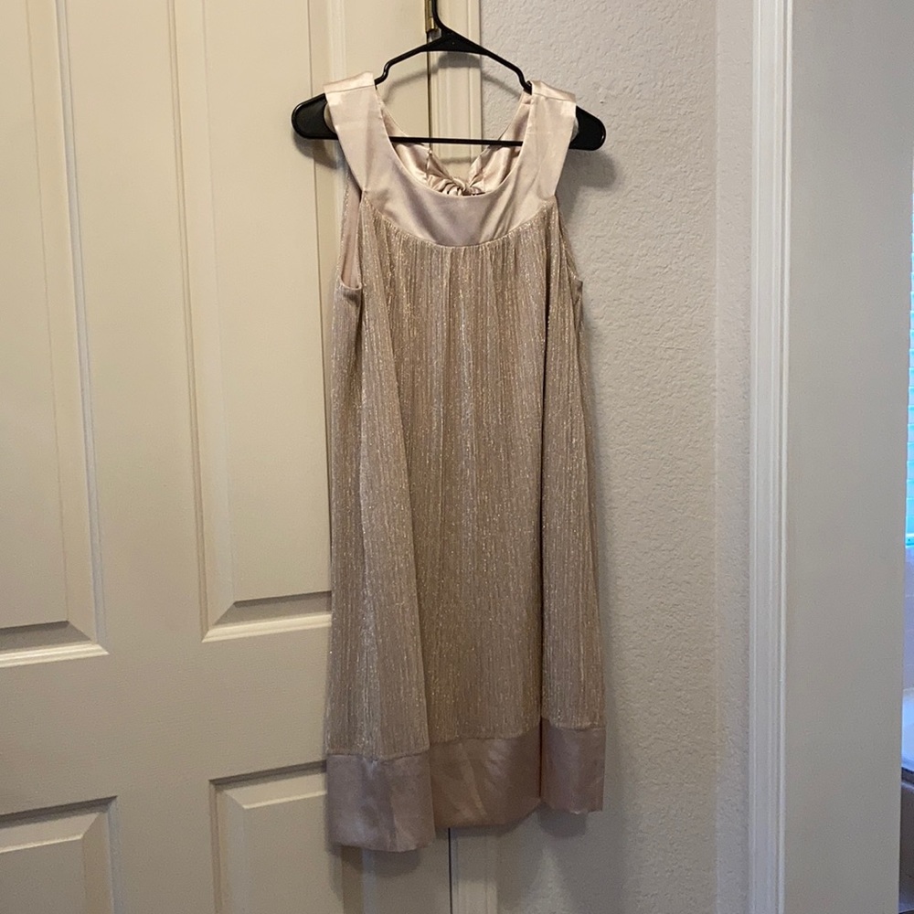 Gold sleeveless dress.